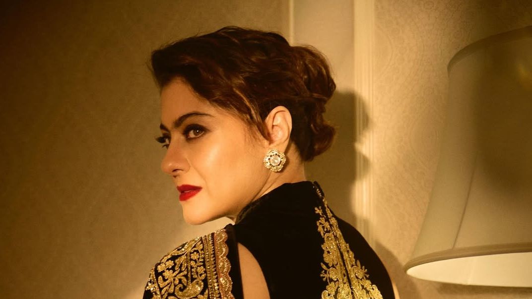 Kajol’s archival black Manish Malhotra sari features zardozi on chenille fabric