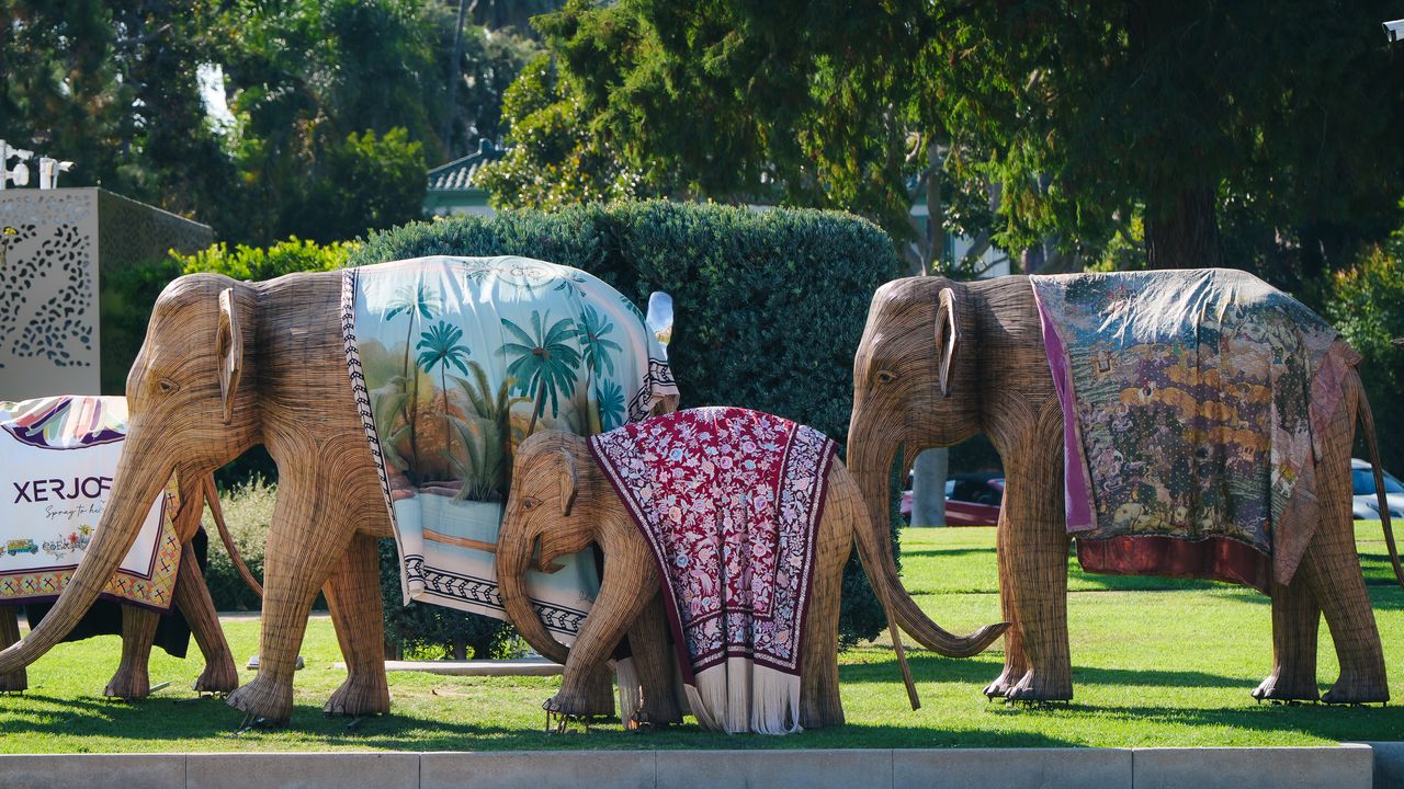 What are 100 blanketed elephants doing in the middle of Los Angeles?