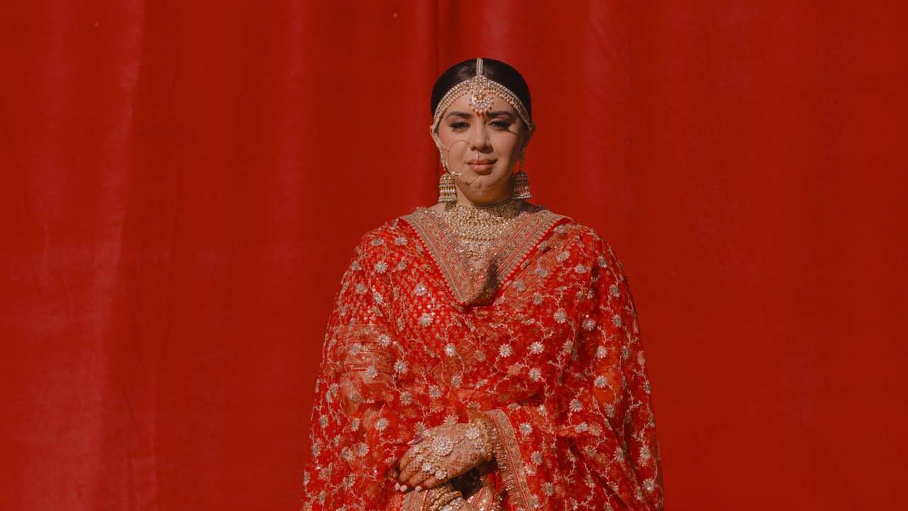 This bride’s classic red vision came alive with a Sabyasachi lehenga for her California wedding
