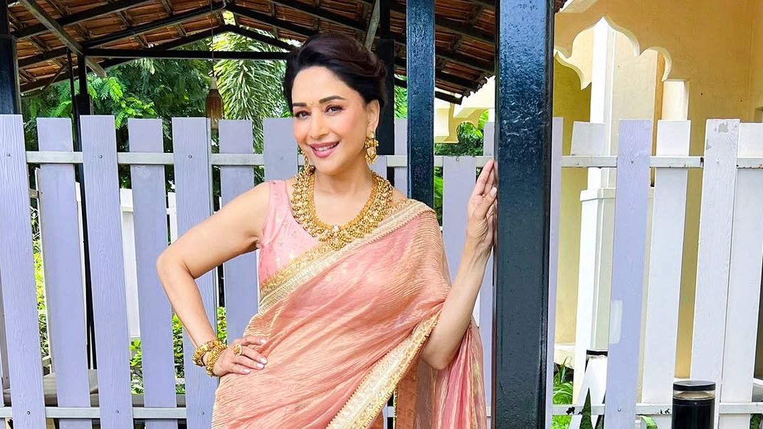 Madhuri Dixit Nene’s silk-tissue sari pairs peach tones with playful palm blooms