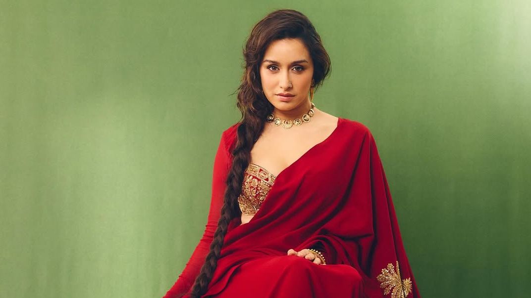Shraddha Kapoor’s scarlet Masaba sari came with a notched bustier and signature palm embroidery