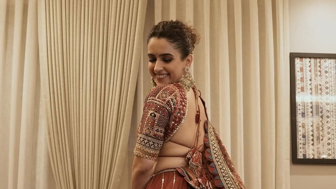 Sanya Malhotra championed Ajrakh in a rust-toned raw silk lehenga embroidered with sequins
