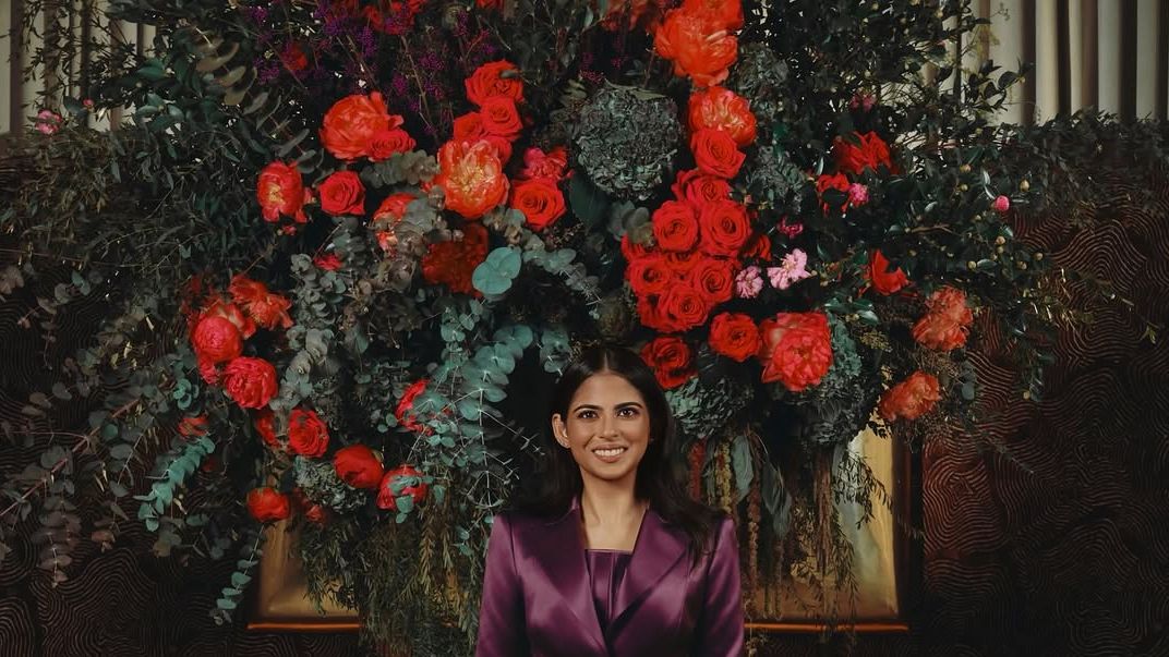 Isha Ambani Piramal’s plum satin suit sharpens into a corseted waist and column skirt