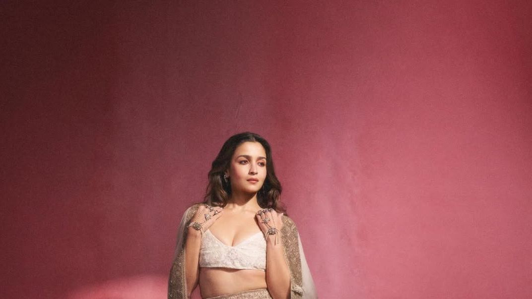 Alia Bhatt’s Anamika Khanna ensemble uses a zardozi-edged cape as its defining layer